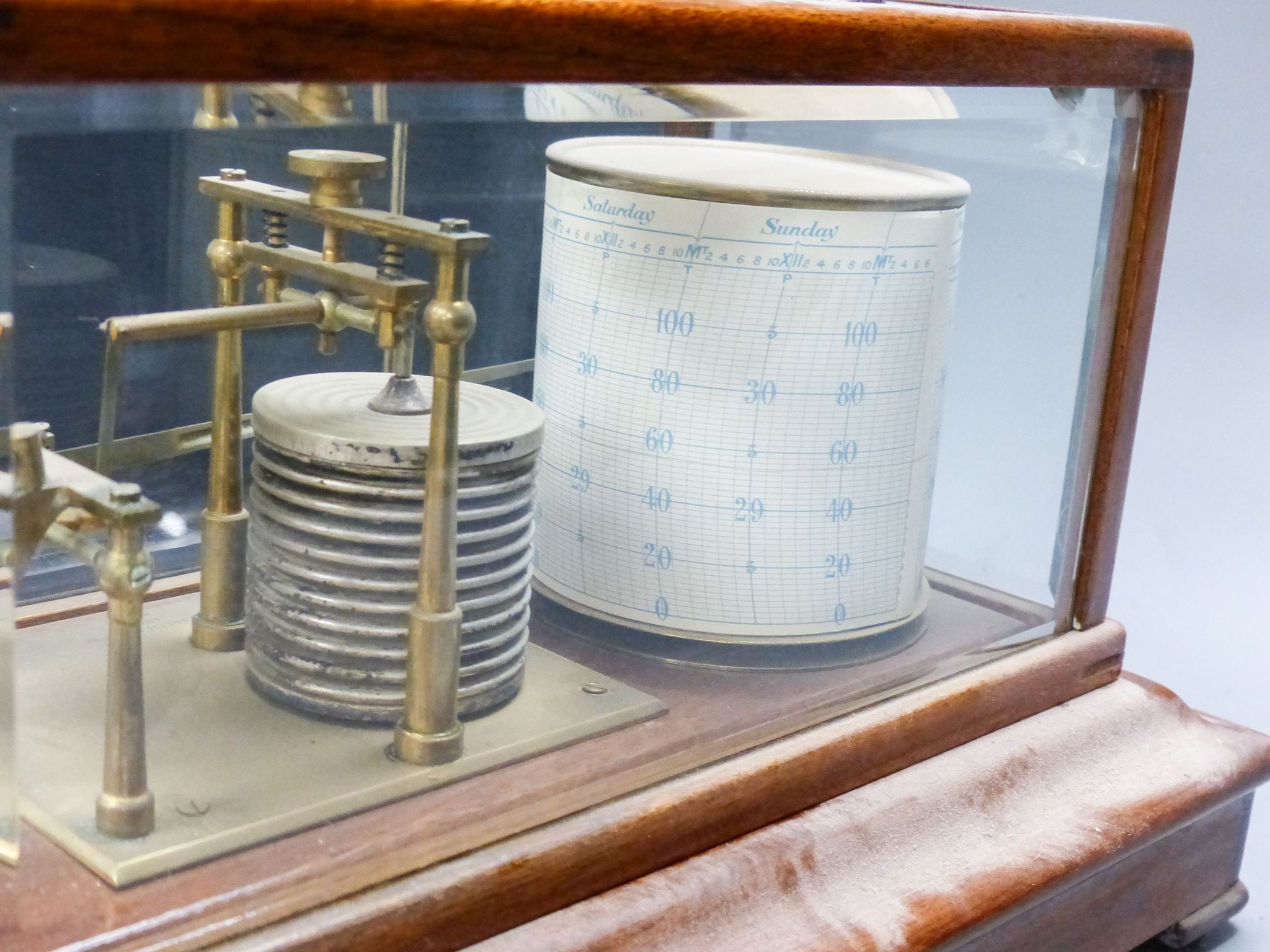 A mahogany cased barograph by Negretti & Zambra No C.13658 with spare graph paper in drawer 37cm